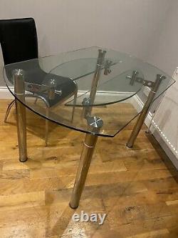 Extendable Round Or Rectangular glass dining table and 4 black chairs