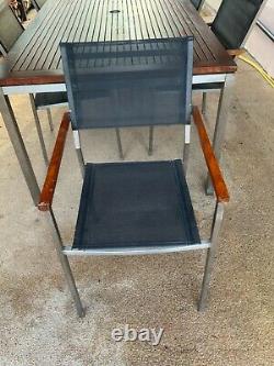 Gloster outdoor dining table and 6 chairs. Teak and Stainless Steel
