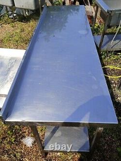 Long, stainless steel table