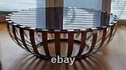 Round stainless steel and glass coffee table
