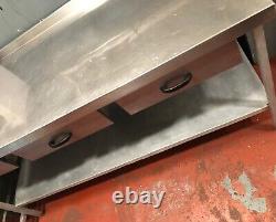 Stainless steel table with drawers